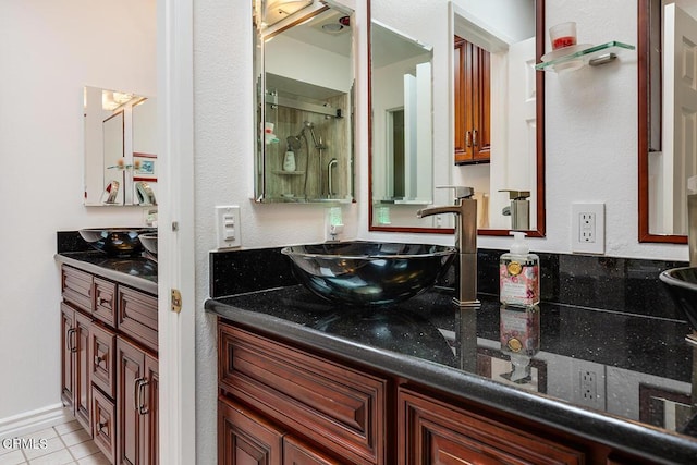 bathroom featuring tile patterned flooring and vanity