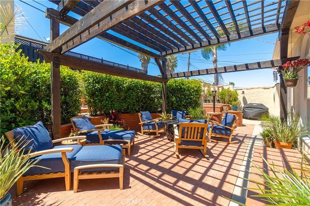 view of patio featuring outdoor lounge area, area for grilling, and a pergola