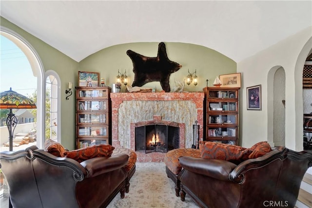 living room featuring lofted ceiling