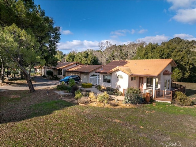 back of house featuring a porch and a yard