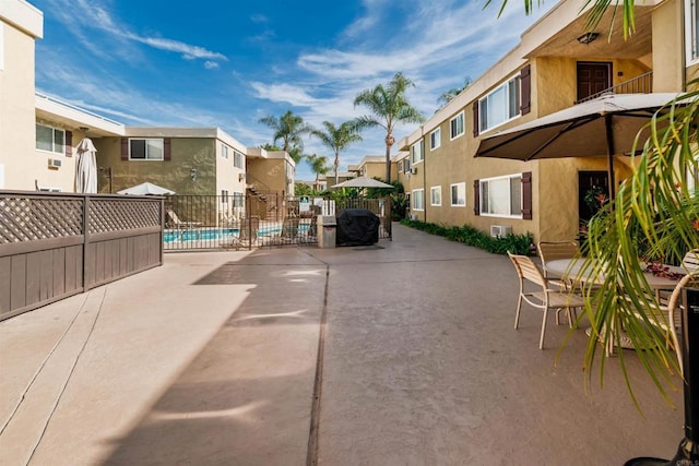 exterior space featuring a pool and a patio area