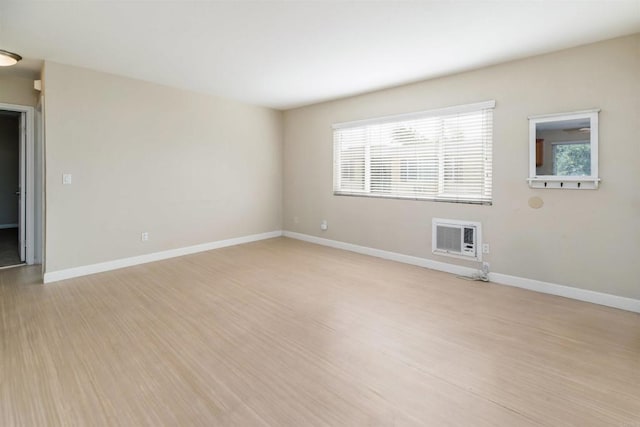 unfurnished room with light hardwood / wood-style floors