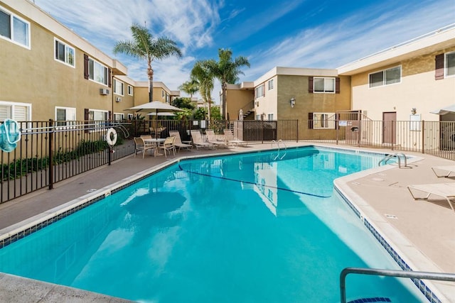 view of swimming pool featuring a patio area