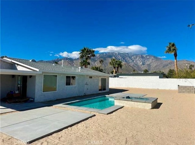 view of pool featuring a mountain view and a patio area