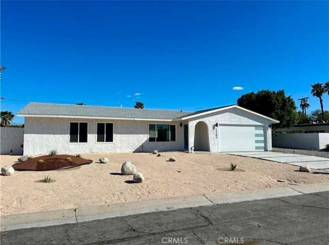 ranch-style home with a garage