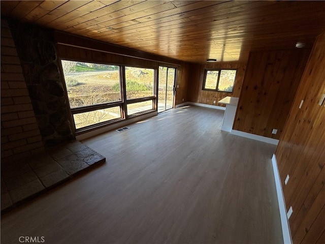 interior space featuring wood ceiling, wooden walls, and dark wood-type flooring