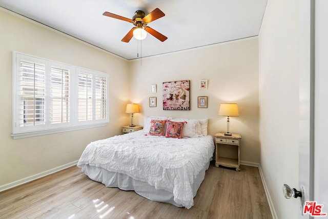 bedroom featuring light hardwood / wood-style flooring and ceiling fan