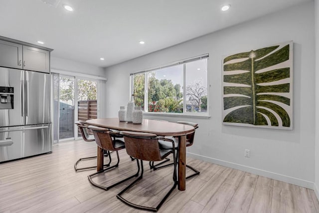 dining space featuring light hardwood / wood-style flooring