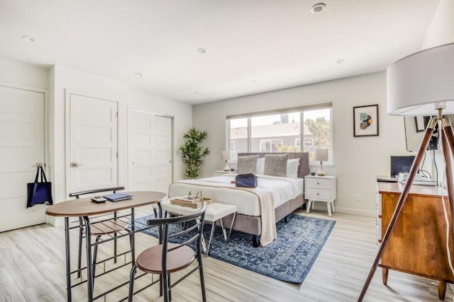 bedroom featuring light hardwood / wood-style floors and a closet