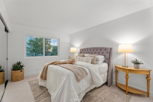 carpeted bedroom with a closet