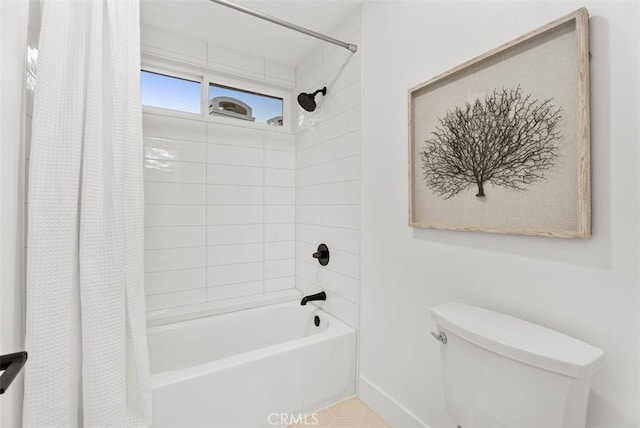 bathroom with shower / bath combination with curtain and toilet