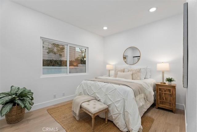 bedroom with light hardwood / wood-style flooring