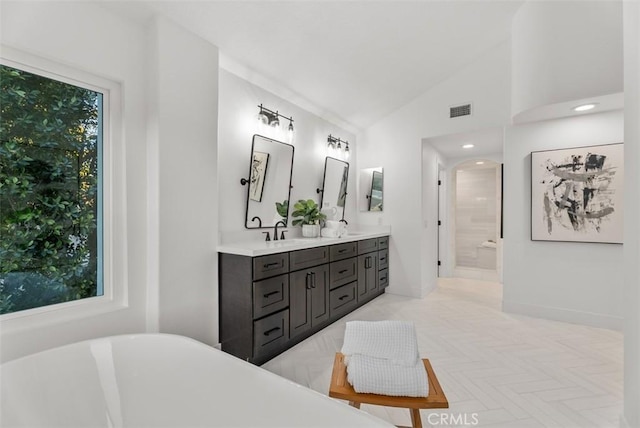 bathroom featuring vanity, parquet floors, high vaulted ceiling, and separate shower and tub