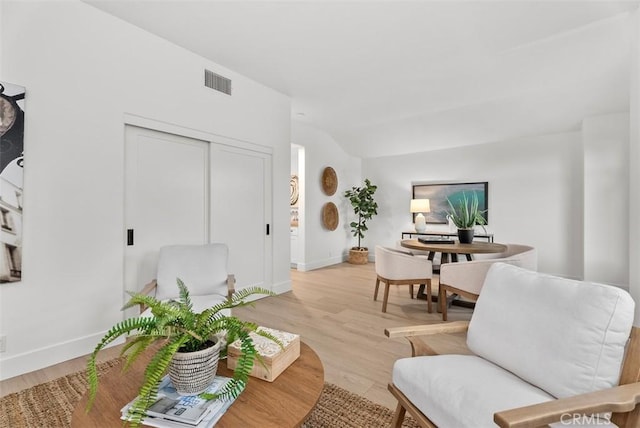 living room with light hardwood / wood-style flooring