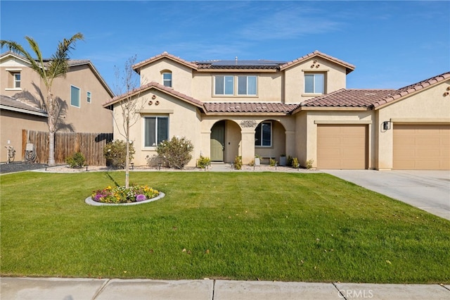 mediterranean / spanish-style house with a garage, a front lawn, and solar panels