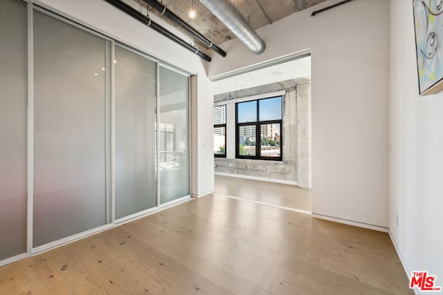 spare room featuring light hardwood / wood-style floors