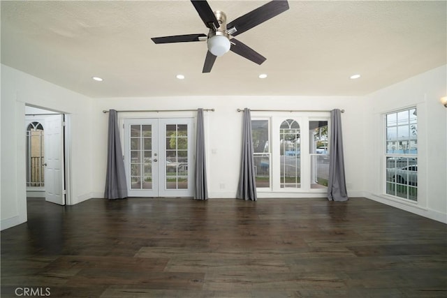 empty room featuring french doors, wood finished floors, and recessed lighting