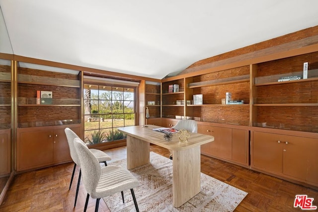 office space with lofted ceiling