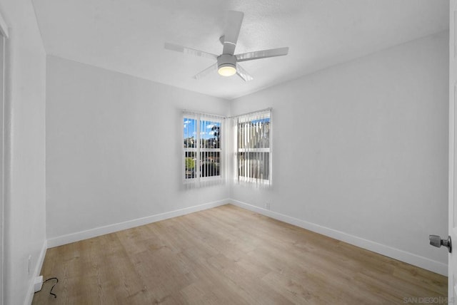 unfurnished room featuring ceiling fan and light hardwood / wood-style flooring