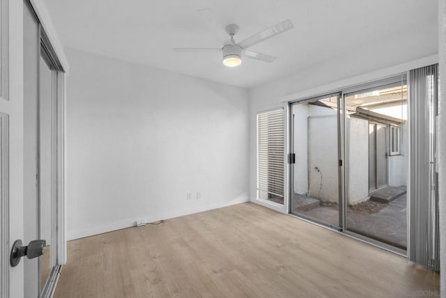 unfurnished bedroom with access to exterior, light hardwood / wood-style flooring, and ceiling fan