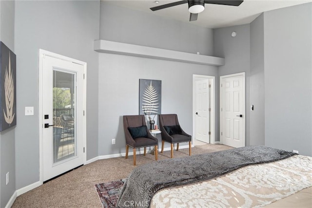 bedroom with a towering ceiling, ceiling fan, carpet flooring, and access to outside