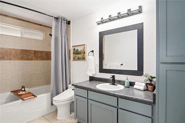 full bathroom with vanity, tile patterned floors, toilet, and shower / bath combo with shower curtain