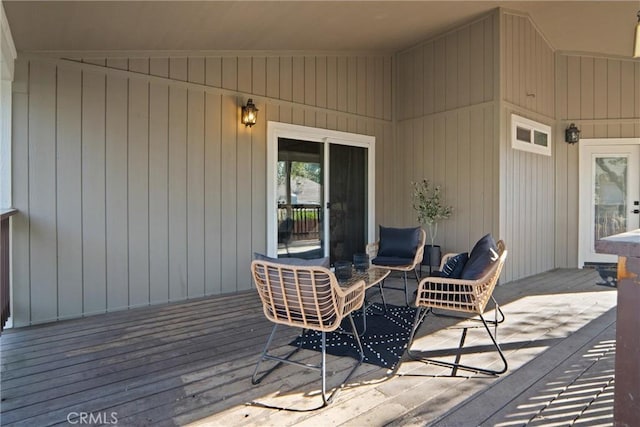 wooden deck featuring an outdoor living space