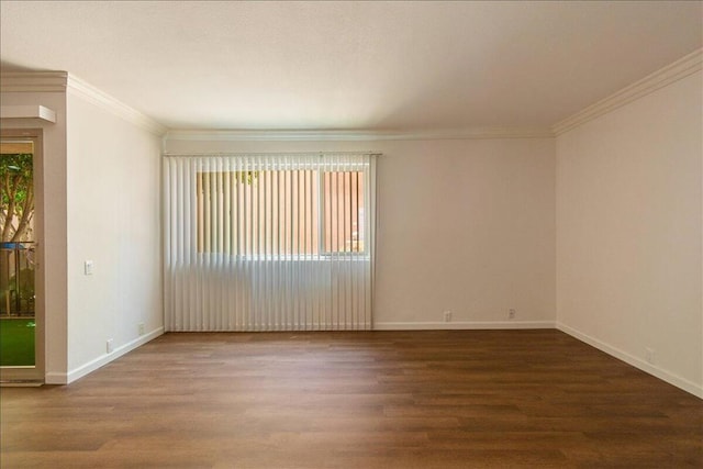 spare room with hardwood / wood-style flooring and ornamental molding