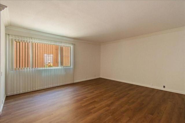 empty room with crown molding and hardwood / wood-style flooring