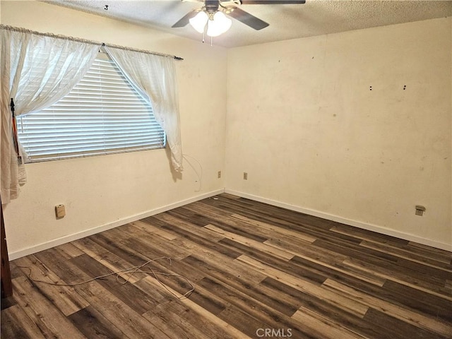 unfurnished room with ceiling fan, a textured ceiling, and dark hardwood / wood-style flooring