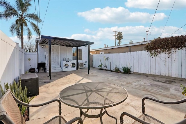 view of patio with washing machine and dryer