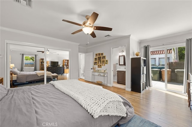 bedroom featuring ensuite bath, ornamental molding, access to exterior, ceiling fan, and light wood-type flooring