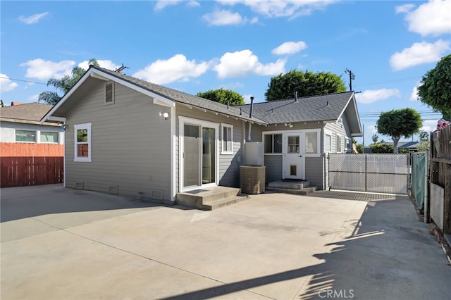 back of property with a patio