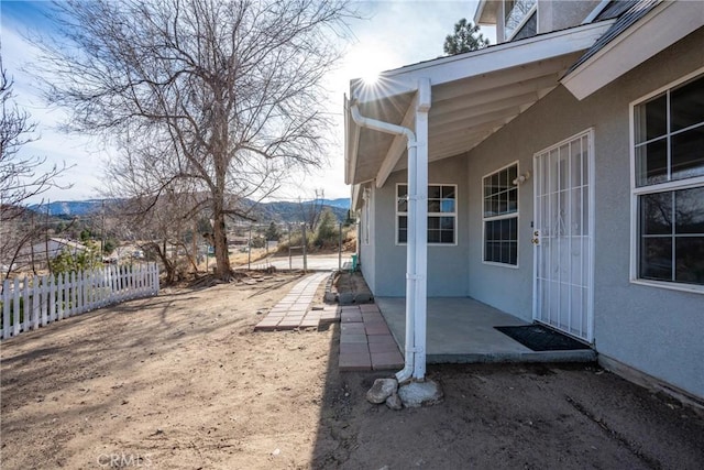 view of yard with a mountain view and a patio area