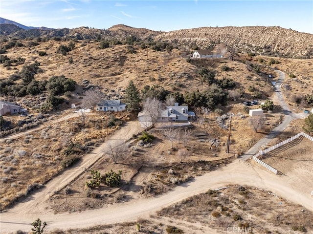 drone / aerial view featuring a mountain view