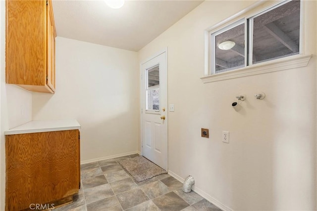 laundry area with cabinets, electric dryer hookup, and washer hookup