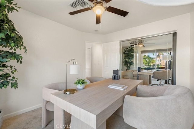 dining room featuring light colored carpet