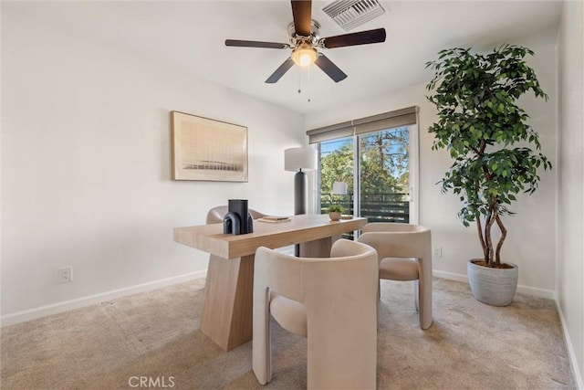 carpeted home office with ceiling fan