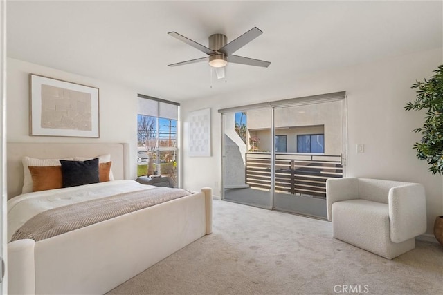 bedroom with ceiling fan, light colored carpet, and access to outside