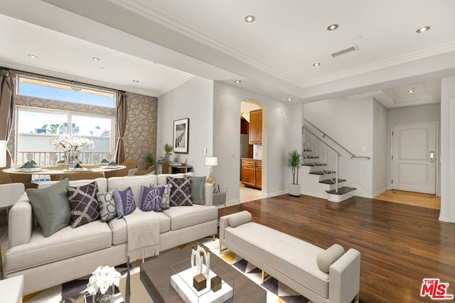 living room featuring ornamental molding and dark hardwood / wood-style flooring