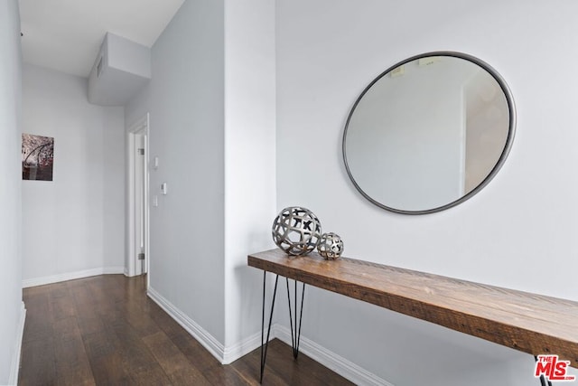 hall with dark hardwood / wood-style flooring