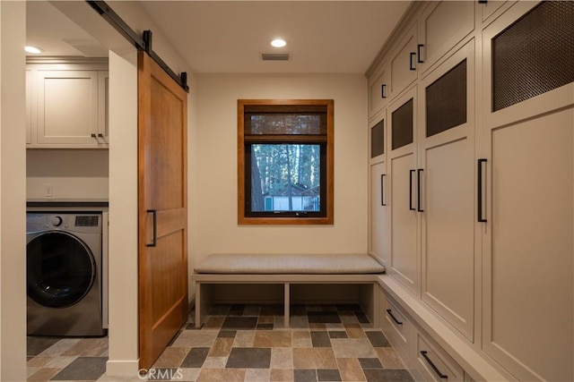 mudroom featuring washer / dryer and a barn door