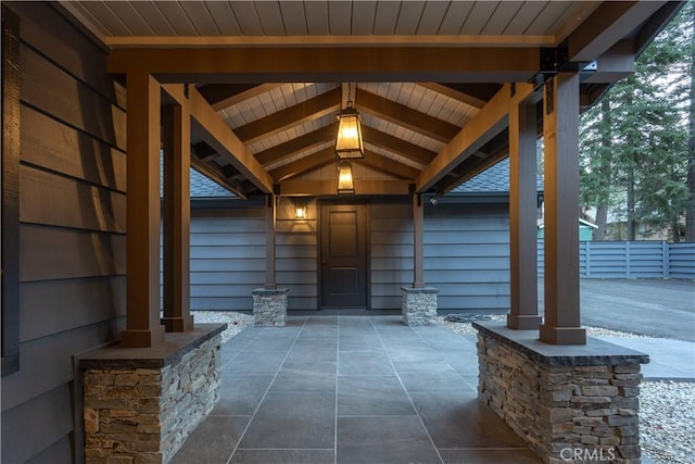 doorway to property with a patio area