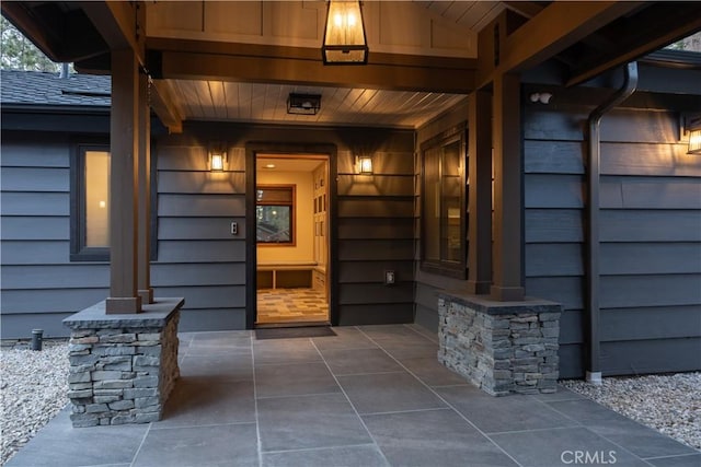 entrance to property featuring a patio area