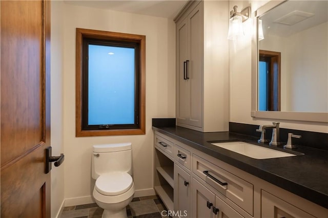 bathroom with vanity and toilet