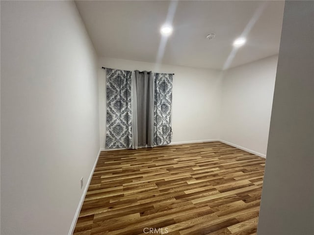 spare room featuring hardwood / wood-style floors