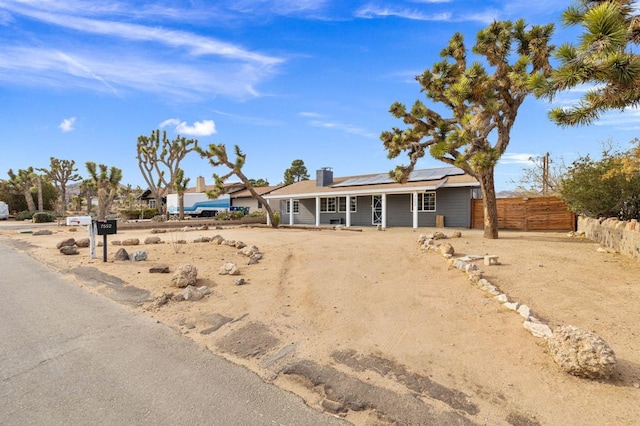 view of front of home with solar panels