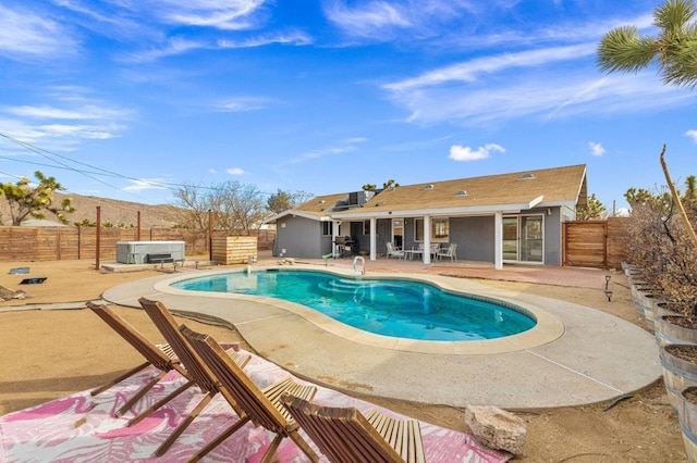 view of pool featuring a hot tub and a patio area