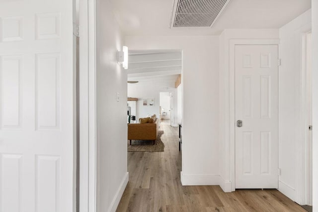 corridor featuring light hardwood / wood-style floors