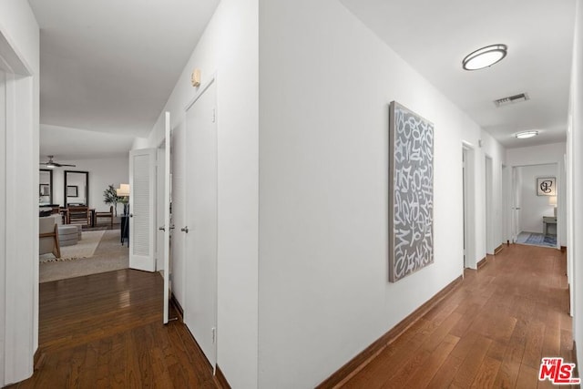 hall featuring dark wood-type flooring